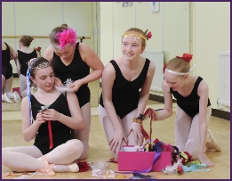 Photo of ballet students making headdresses