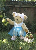 Photo of Melody Bear with a basket of apples